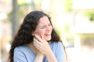 Woman suffering jaw ache